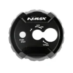 The Nitex CNC Ignition Key Cover is an aftermarket accessory specifically designed for Yamaha NMAX motorcycles. It is a cover that fits around the ignition key area, providing added protection and enhancing the overall aesthetic of the bike.